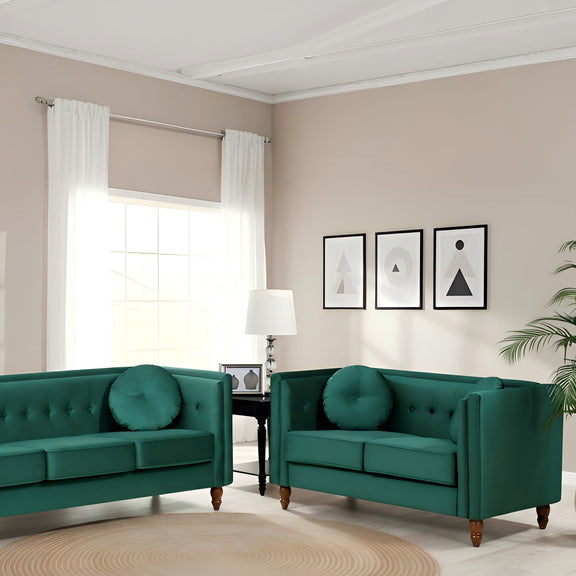 Dark green 2-seater velvet loveseat with tufted back and round accent pillows