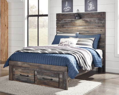 Dark wood panel bed with slatted headboard, blue throw, and front drawer storage