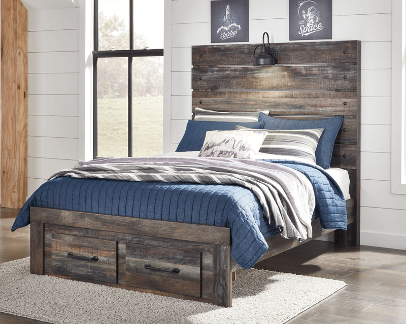 Dark wood panel bed with slatted headboard, blue throw, and front drawer storage