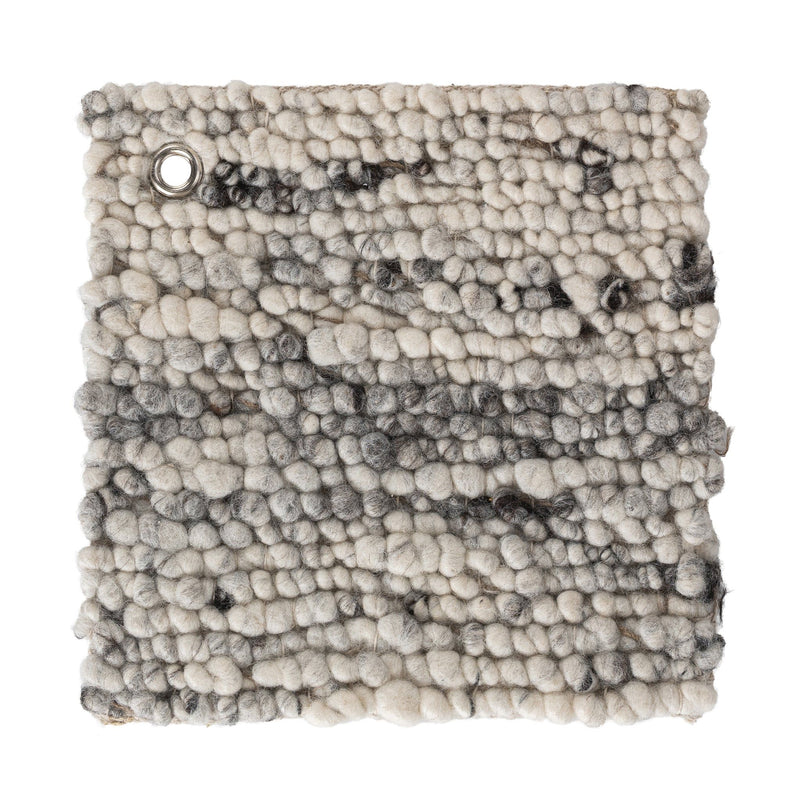 Looped wool rug swatch with thick pile and a metal grommet at the corner.