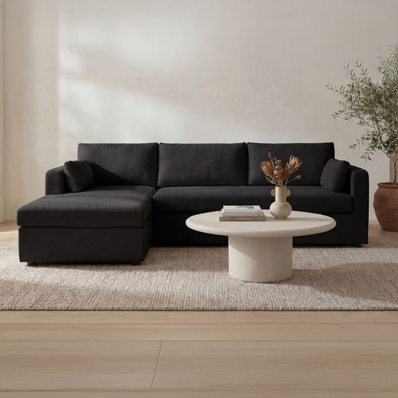 Black sleeper sectional sofa with left chaise and three back cushion sections