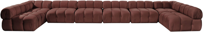 Deep red modular sectional sofa with tufted cushions and curved arm sections