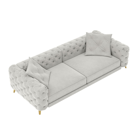 Gray 3-in-1 convertible sleeper sofa with tufted back, rolled arms, and two pillows