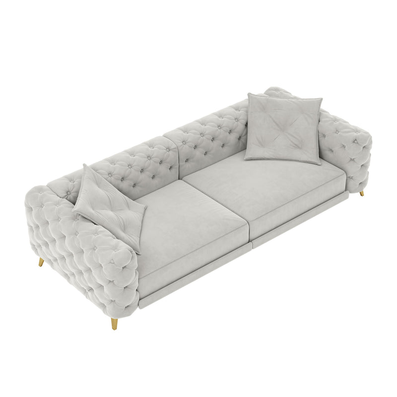 Gray 3-in-1 convertible sleeper sofa with tufted back, rolled arms, and two pillows