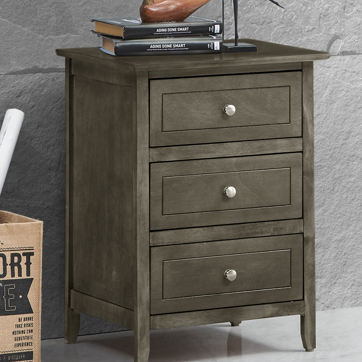 Dark gray 3-drawer nightstand with three drawers and metal knobs