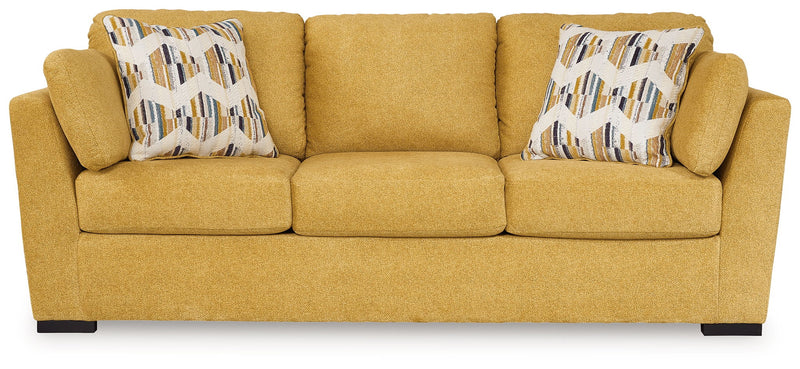 Keerwick sunflower upholstered sofa with rolled arms and two geometric patterned pillows