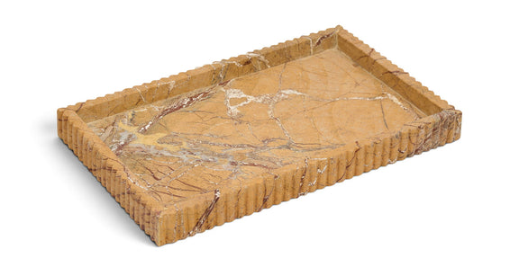 Tan marble tray with carved ridged border and bold veining on the top