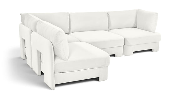 Armless velvet performance fabric sectional, white 4-piece corner setup with plush cushions.