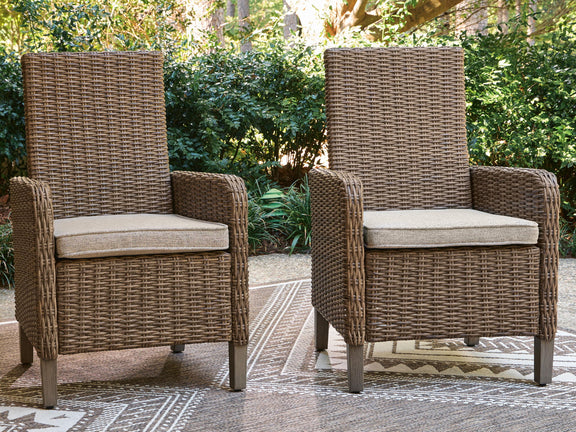 Outdoor set of 2 beige woven arm chairs with light seat cushions and arms
