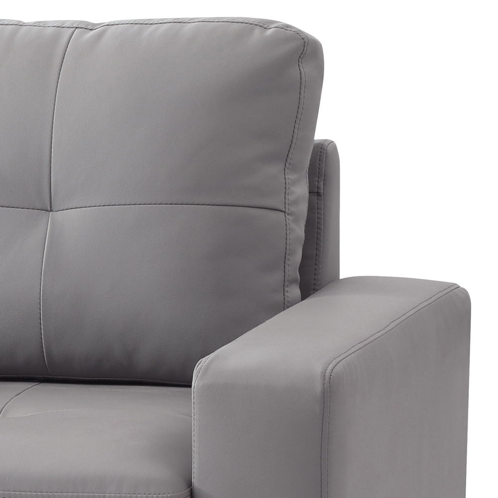 Light gray upholstered accent chair close-up of high back cushion and armrest