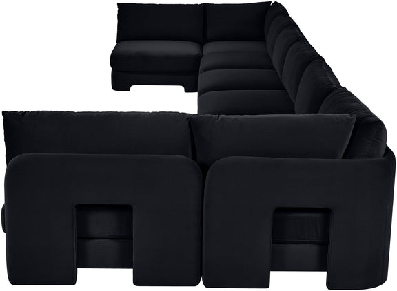 Black velvet U-shaped armless sectional sofa with padded cushions and chaise backrests