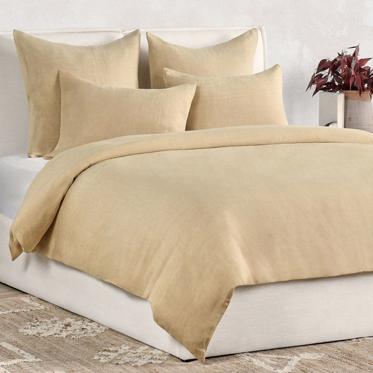 Hemp duvet in warm ochre with matching pillow shams, bed styling view