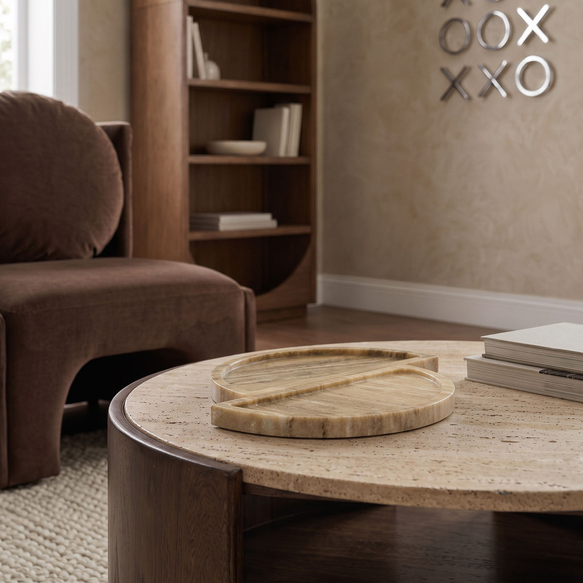 Beige marble tray on a coffee table with two round split halves