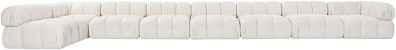 White velvet L-shaped sectional sofa, side view of tufted cushion blocks