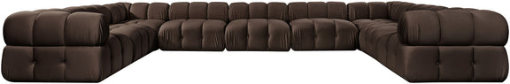 Dark brown velvet sectional with tufted cushions and curved corner chaise