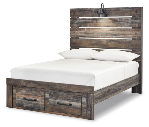 Drystan panel bed with dark wood headboard and two front drawers; white mattress with pillows.