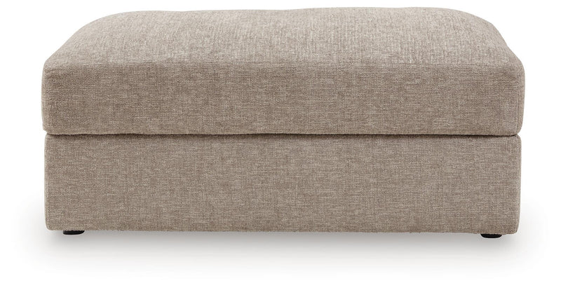 Oversized accent ottoman with rounded top and light beige cushioned sides