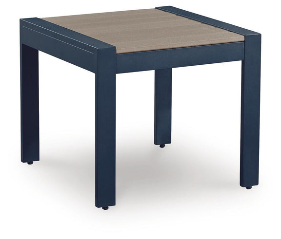 Blue rectangular patio cocktail table with beige slatted top and four corner legs