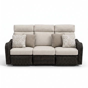 Three-seat brown wicker recliner sofa with beige cushions and patterned throw pillows