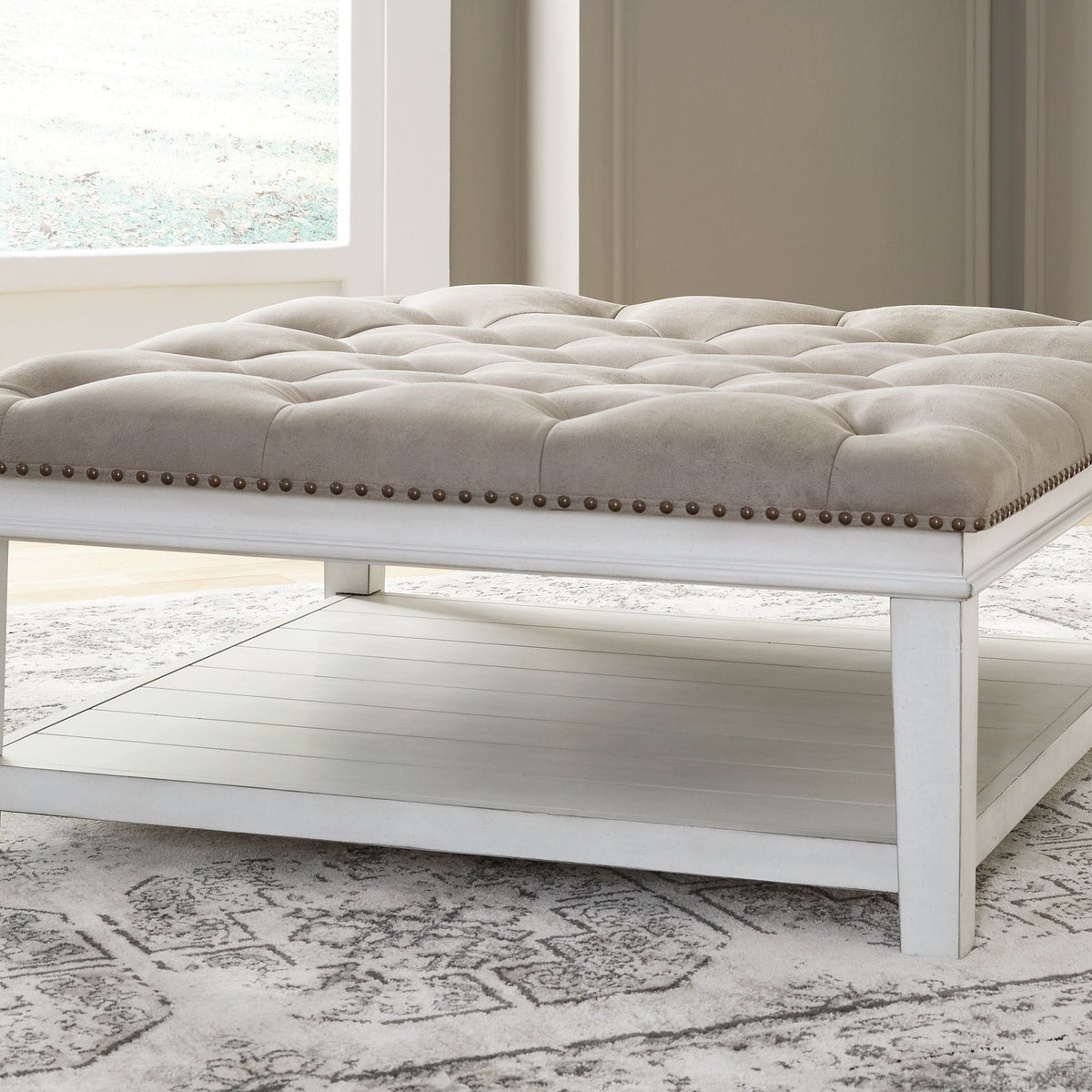 Kanwyn - Whitewash - Uph Ottoman Cocktail Table