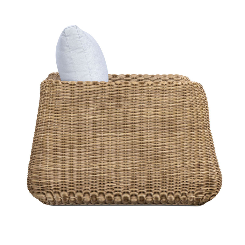 Outdoor accent chair with light blue back pillow and woven wicker base
