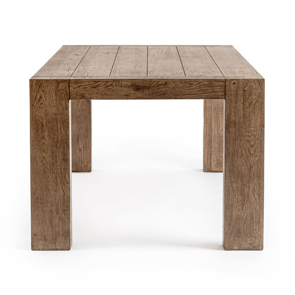 Rectangular dining table in natural oak wood grain with block legs, front view