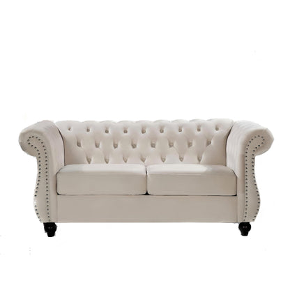 Beige tufted button loveseat with rolled arms and studded nailhead trim, two-seat design.