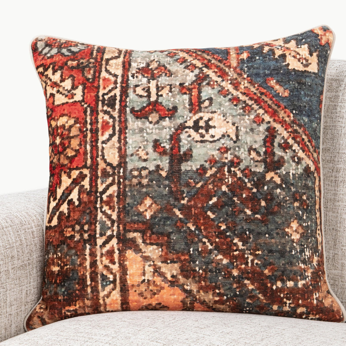 Decorative 22" square pillow with multicolor patterned front on textured fabric