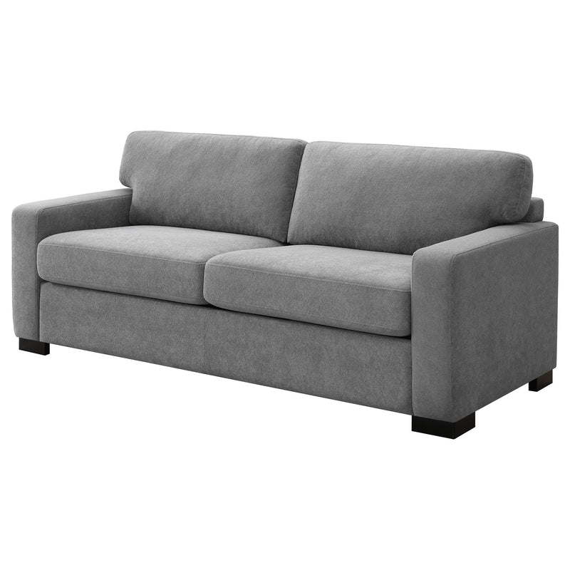 Gray upholstered sleeper sofa with back cushions, track-style arms, and black base feet