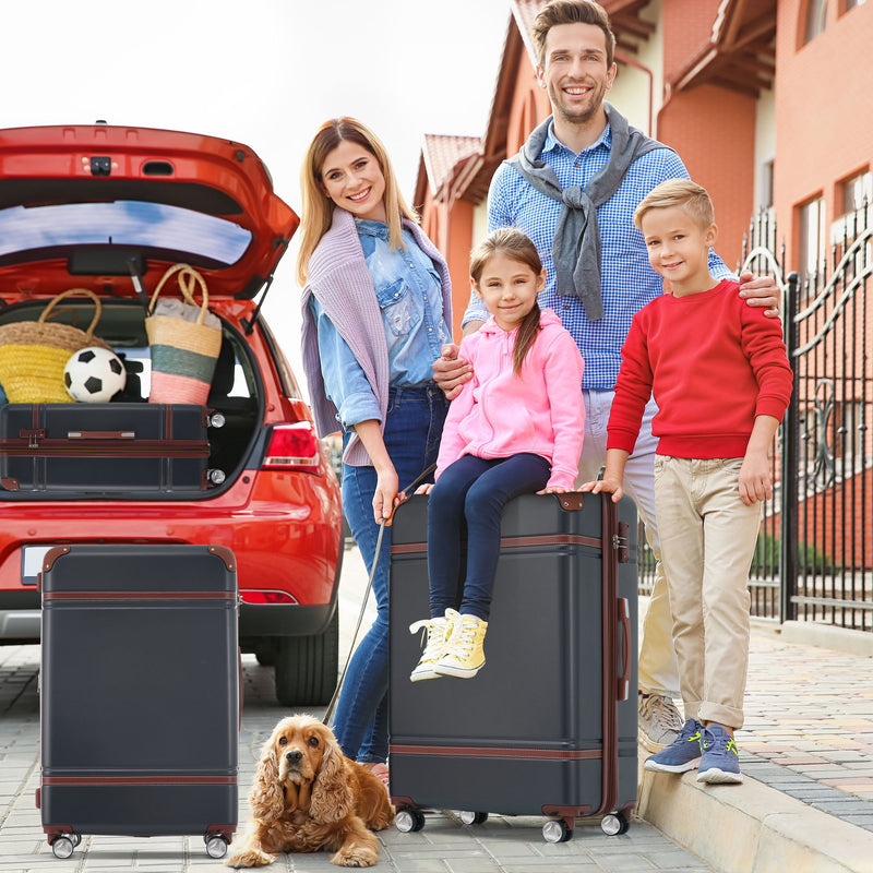 Black spinner suitcase with telescoping handle, brown trim, and four rolling wheels