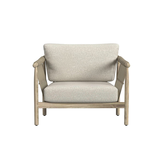 Outdoor accent chair with woven arm sides, tall backrest, and light taupe fabric seat