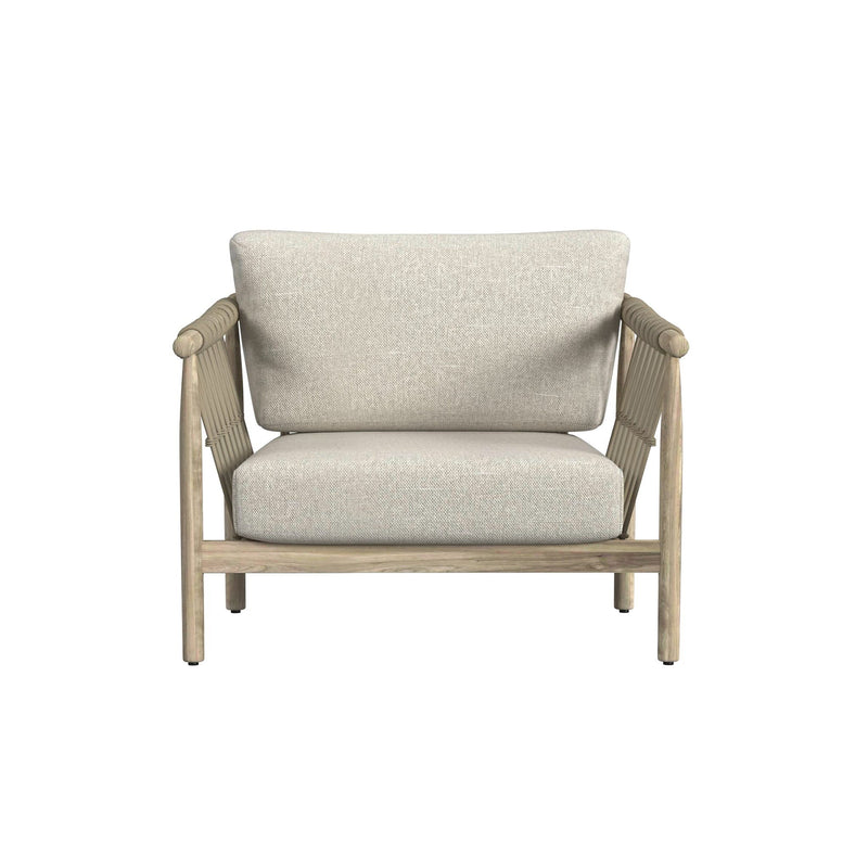 Outdoor accent chair with woven arm sides, tall backrest, and light taupe fabric seat