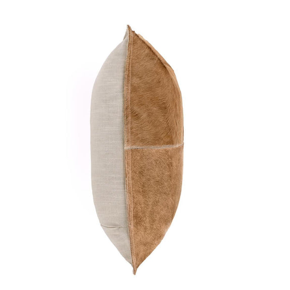 Tan hide pillow, side view with stitched quadrants and contrast fur panels