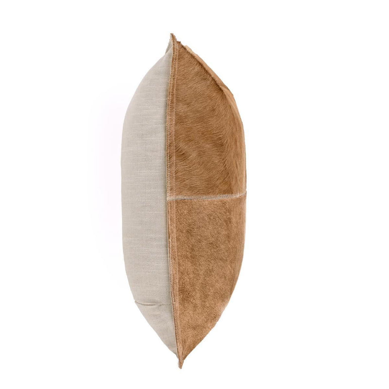 Tan hide pillow, side view with stitched quadrants and contrast fur panels