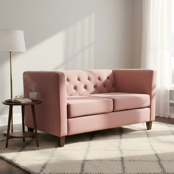 Pink button-tufted loveseat with square arms, two-seat cushions, and dark feet
