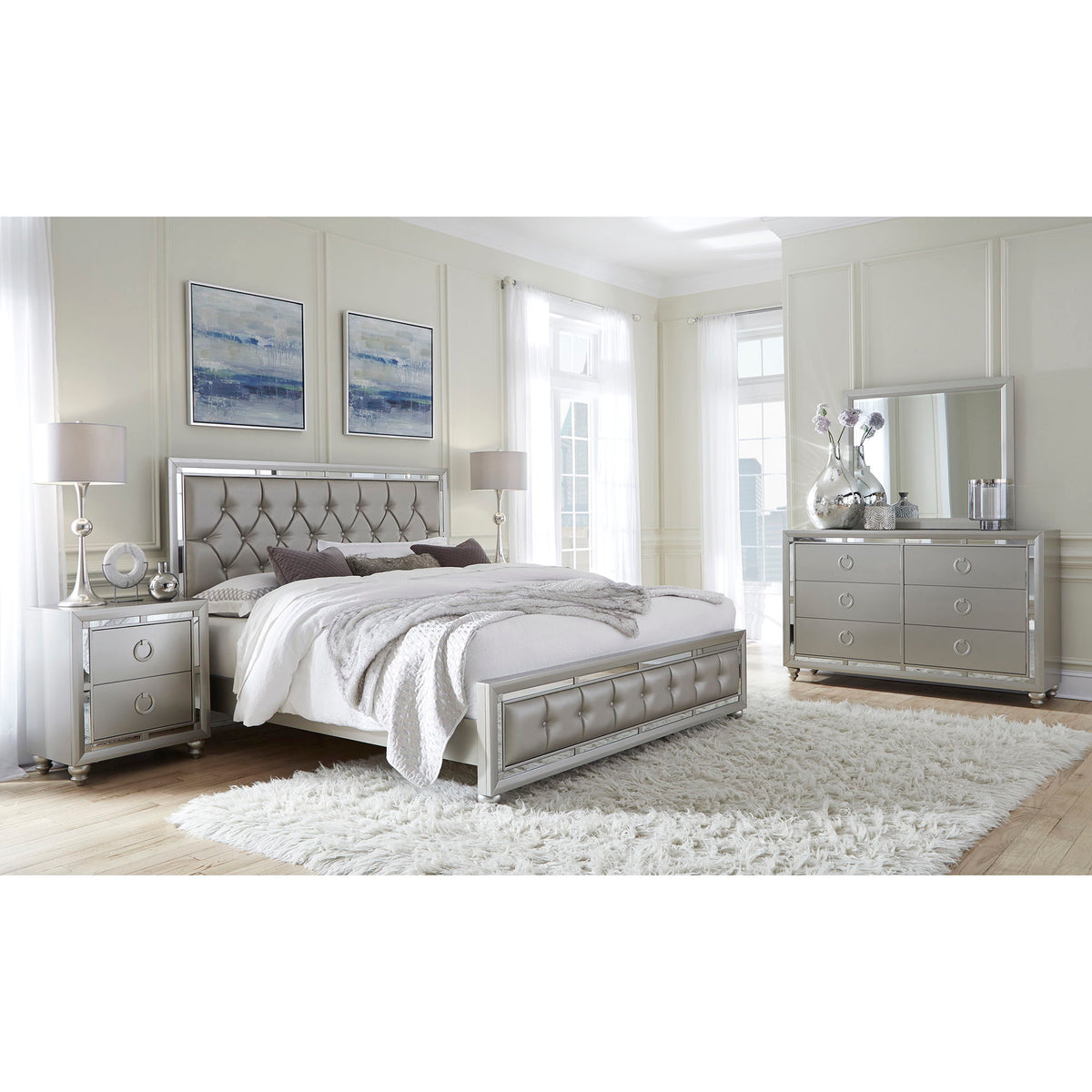 Pearl silver tufted upholstered bed with headboard, footboard, and layered bedding