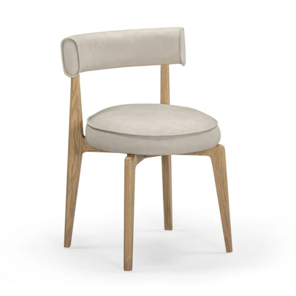 Beige fabric dining chair with curved back, oval seat cushion, light wood legs, side view.
