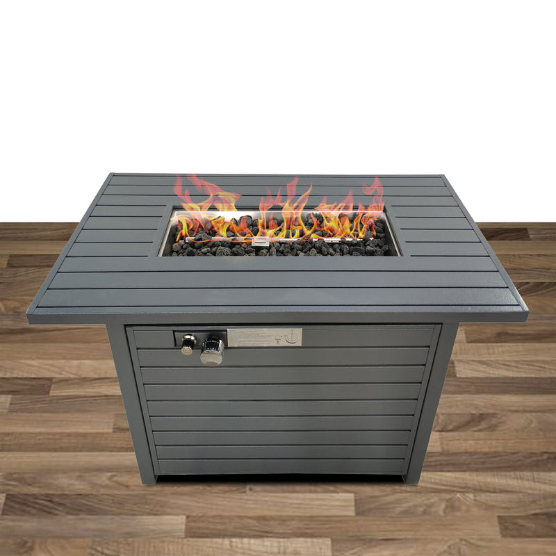 Gray propane outdoor fire pit table with open lid, flames over lava rocks