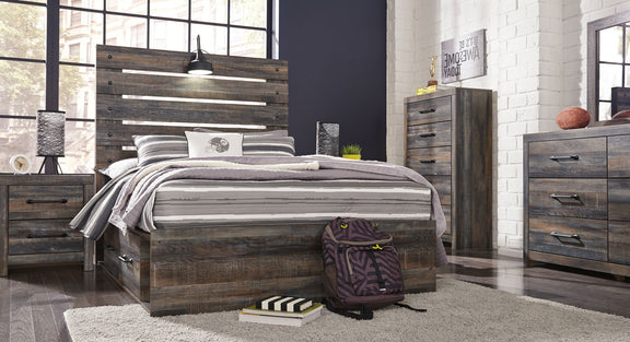 Drystan panel bed with dark wood storage drawers, slatted headboard, and striped bedding setup.