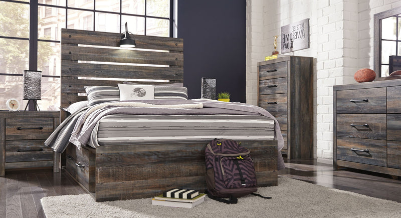 Drystan panel bed with dark wood storage drawers, slatted headboard, and striped bedding setup.