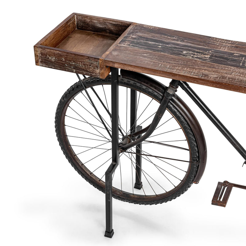 Small bike-style counter table corner view with wood top and front wheel detail