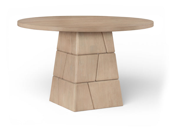 Light brown round dining table with stacked block pedestal base and smooth round top