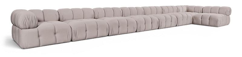 L-shaped velvet sectional sofa in light gray with tufted cushions and rolled arms