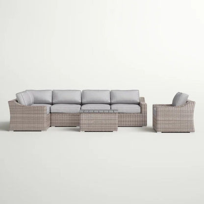 Outdoor sectional seating set with light gray cushions, woven frame, and matching side chair