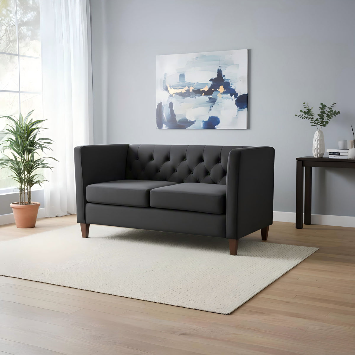 Black button-tufted 2-seat loveseat with square arms and wooden legs