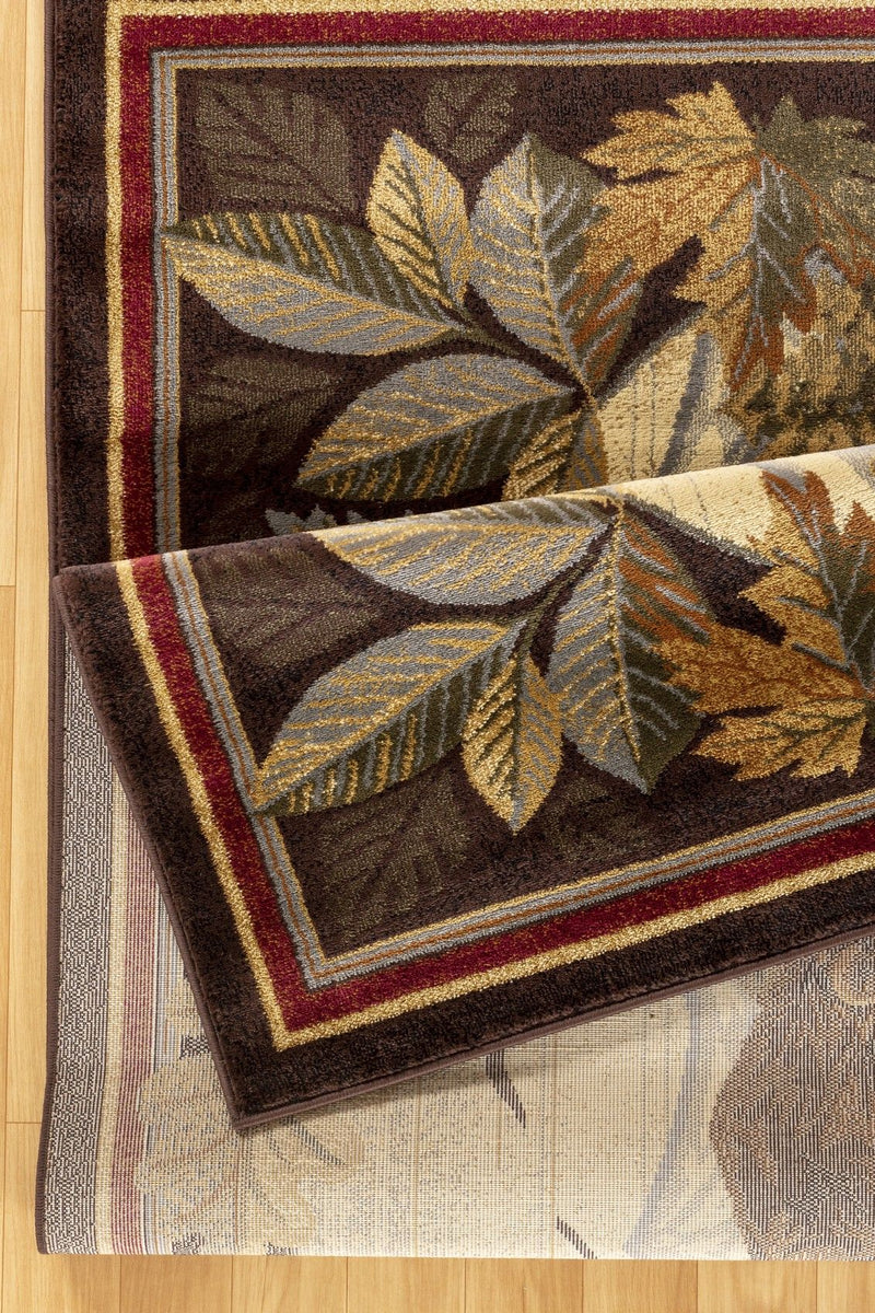 Lodge area rug corner detail with oak leaf pattern, dark brown and cream accents