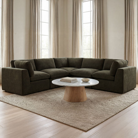 Dark green corner sectional sofa with low arms and padded seat and back cushions