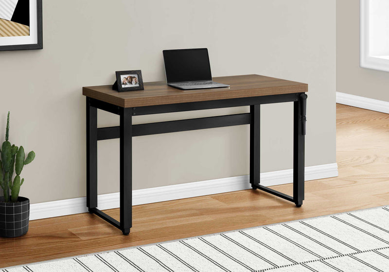 Dark brown wood top standing adjustable computer desk with black metal legs
