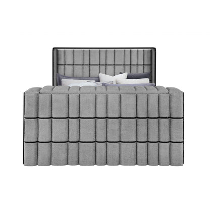 Dark gray upholstered platform bed with tall headboard and vertical paneling