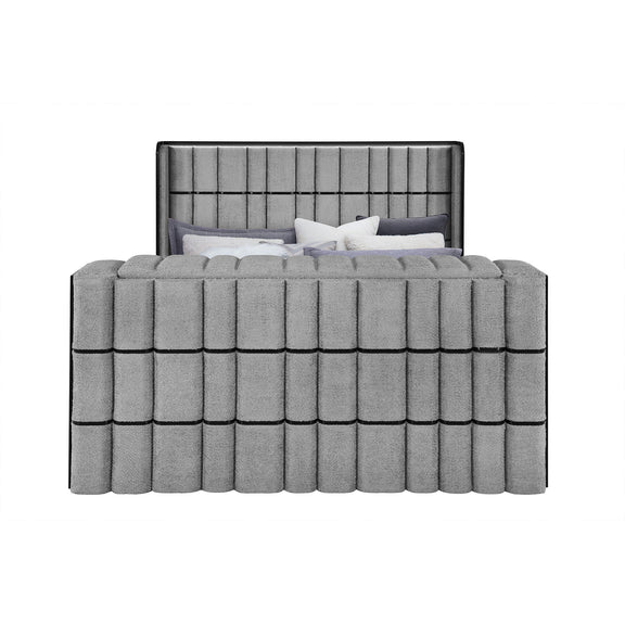 Dark gray upholstered platform bed with tall headboard and vertical paneling